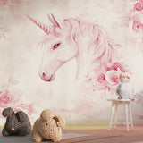 Unicorn wall mural in a bright girl's bedroom, showing pink floral fantasy design with soft lighting