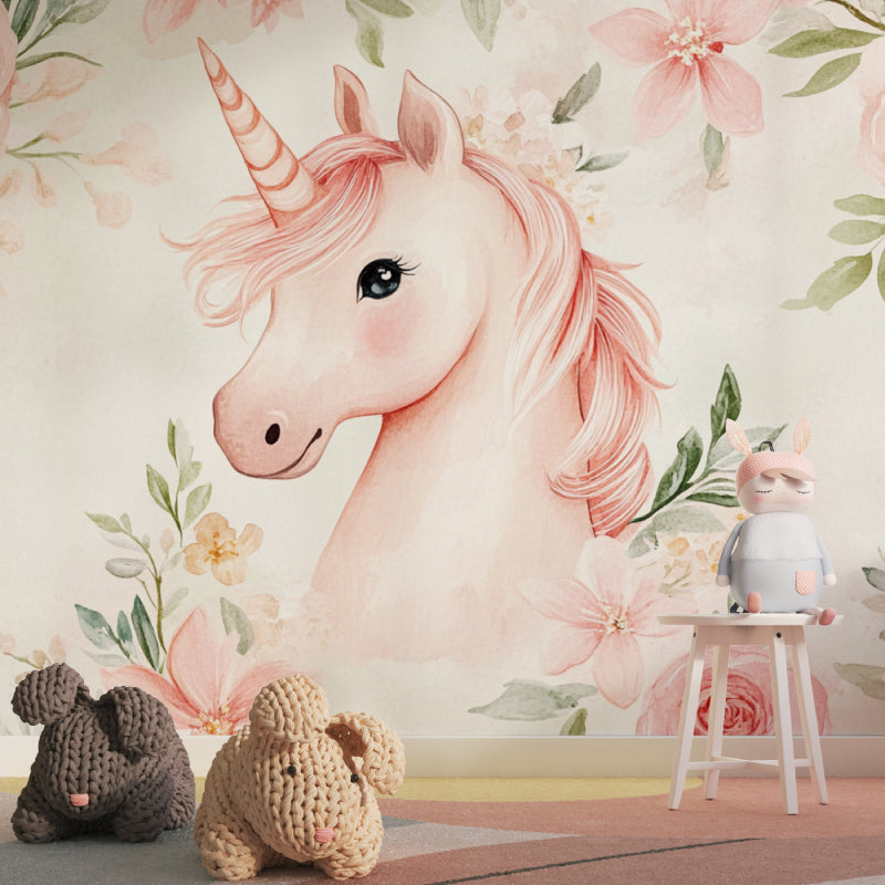 Pink unicorn wallpaper in a bright nursery with white furniture and soft pink accents