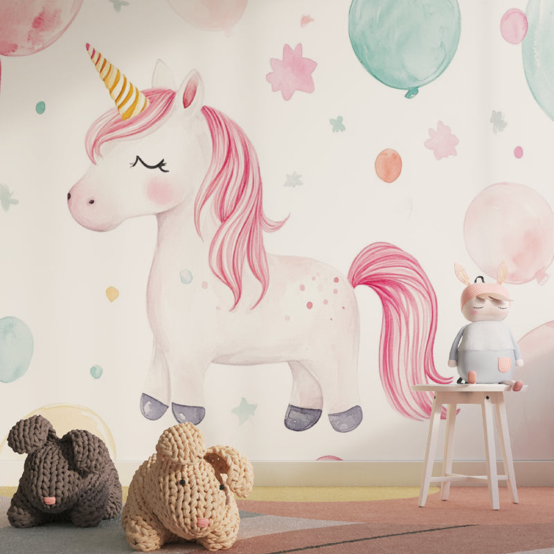 Unicorn and balloon mural adding charm to a baby girl's changing area
