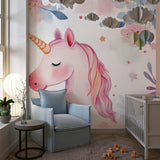 Unicorn wallpaper mural in a bright nursery with white furniture showing the magical watercolor design