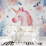 Pink unicorn wall mural styled in a girl's bedroom with pastel decor