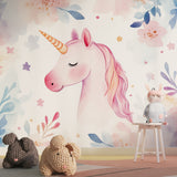 Watercolor unicorn mural installed in a modern kids reading nook