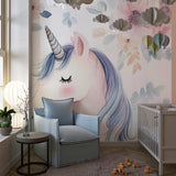 Fantasy unicorn wall mural displayed in a modern nursery with white furniture