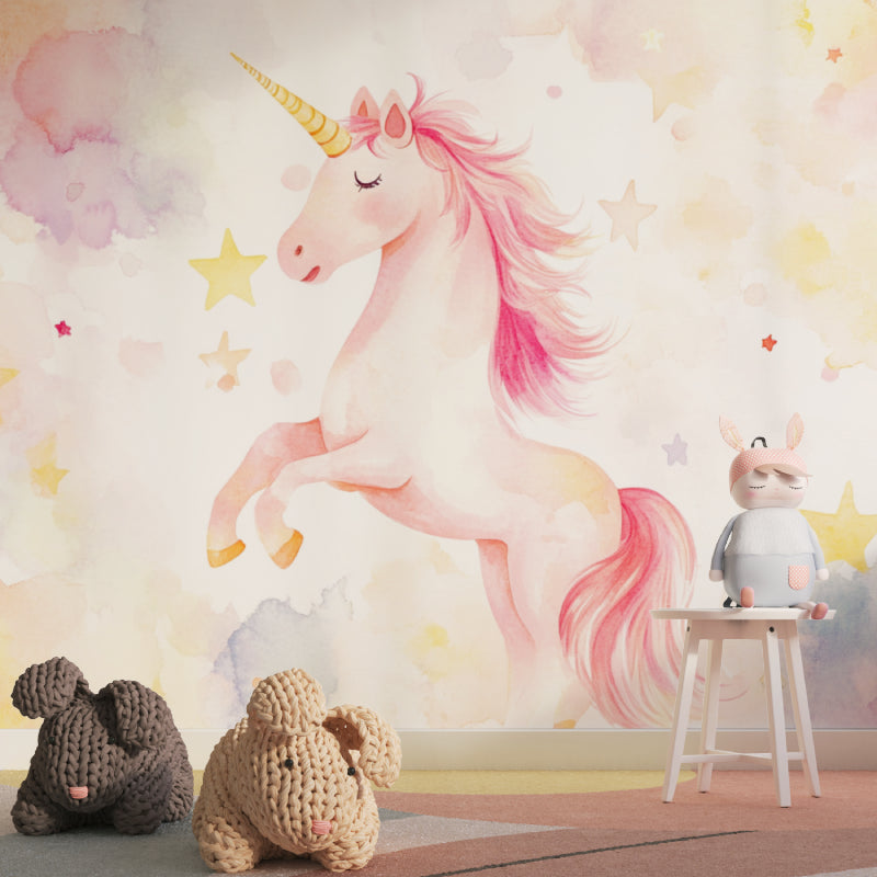 Pink and gold unicorn mural creating a cozy reading nook in a children's room