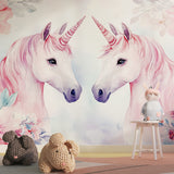 Pink unicorn mural wallpaper in a cozy reading nook