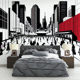 Japanese city wallpaper mural styled in a modern minimalist living room, showing dramatic red accents against black and white urban scene