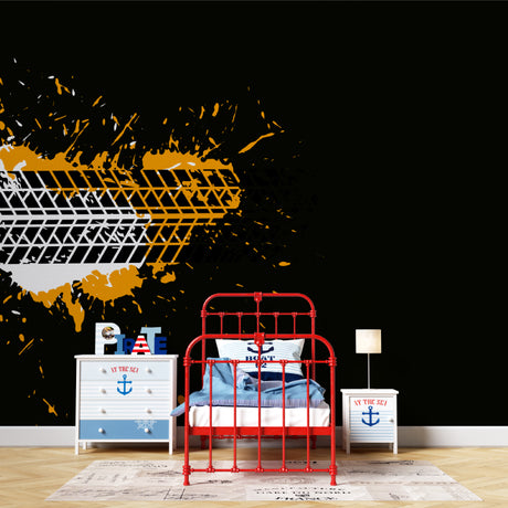 Urban tire track wallpaper with orange splash bringing energy to a modern home office setup