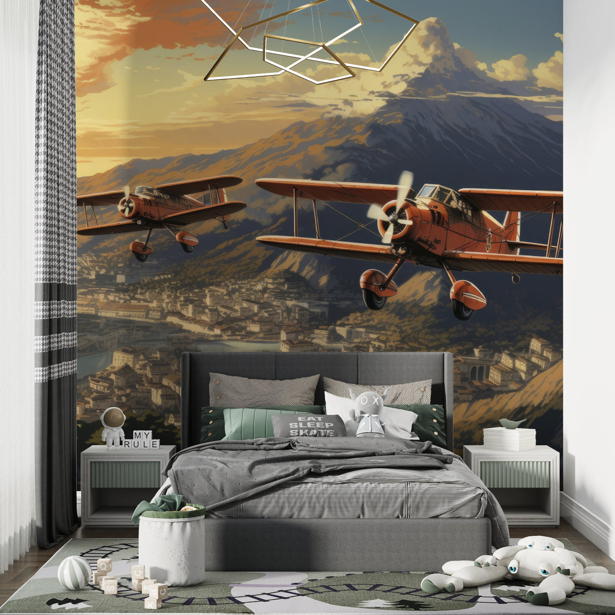 Home office featuring vintage airplane wallpaper with golden hour mountain scene