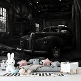 Vintage car wallpaper in modern living room showing black and white industrial design