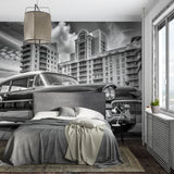 Vintage car wallpaper creating striking focal point in modern living room with Art Deco elements
