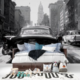 Urban scene wallpaper featuring vintage car in modern bedroom setting