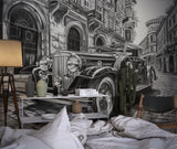 Retro car wallpaper installation in bachelor pad showing dramatic urban scene