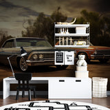 Retro car mural adding character to man cave with sunset backdrop