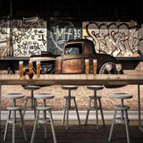 Graffiti car wallpaper making a statement in a modern dining room