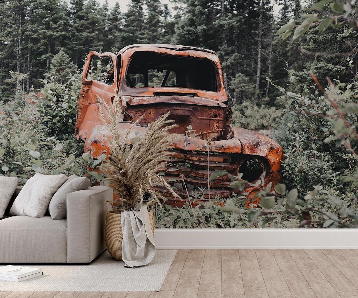 Vintage car wallpaper creating a cozy atmosphere in a modern living room with natural light highlighting the forest backdrop