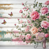 Pink rose and butterfly wallpaper mural creating a garden feel in a bright dining room with white furniture