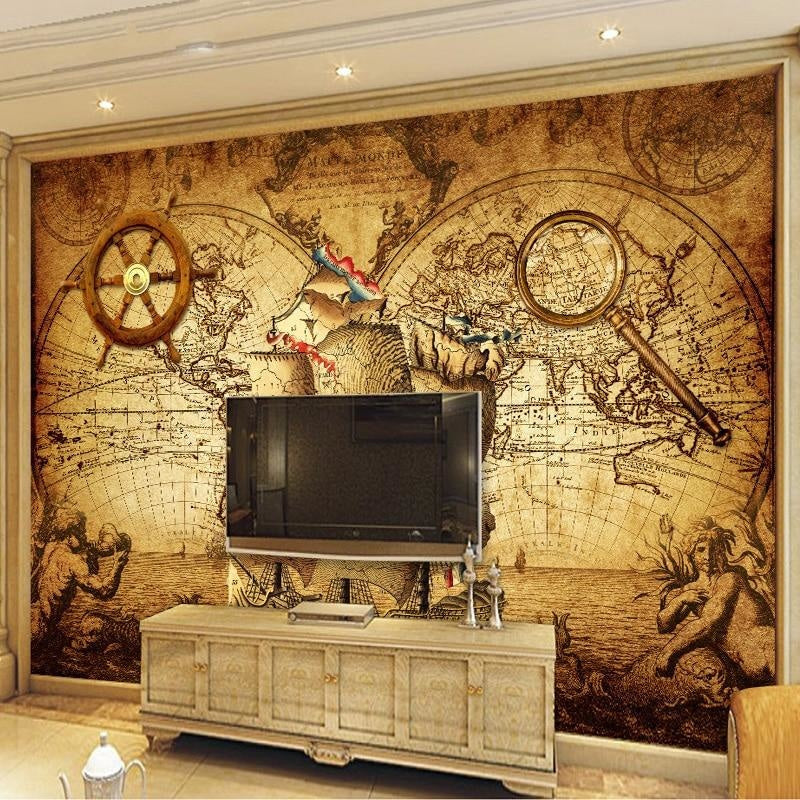 Antique map wallpaper in living room with leather furniture