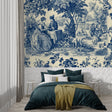 Blue Toile de Jouy wallpaper in an elegant dining room with crystal chandelier and French furniture