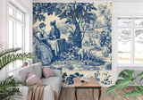 French countryside Toile wallpaper creating depth in a cozy living room setting