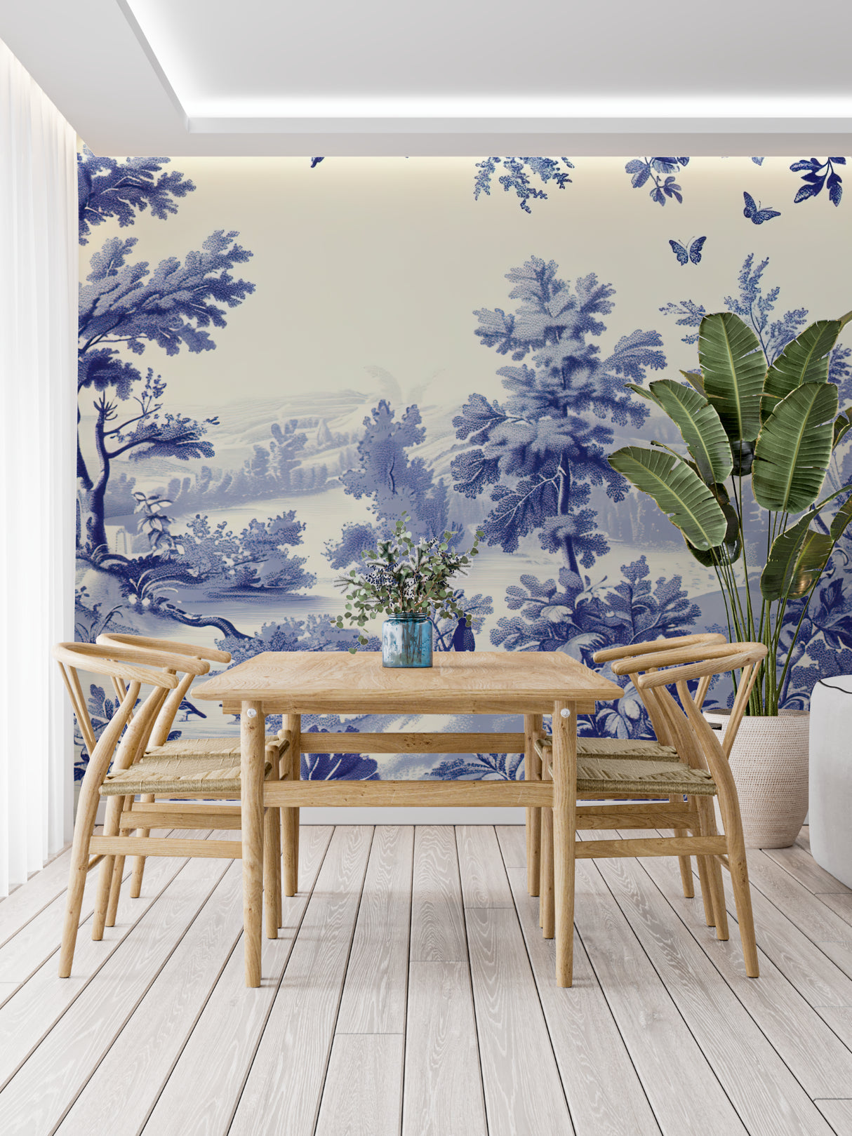 Blue Toile de Jouy wallpaper in a bright living room with French country furniture