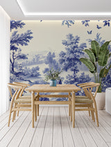 Blue Toile de Jouy wallpaper in a bright living room with French country furniture