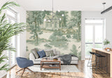 Pastoral toile wallpaper creating cozy reading nook in living room