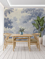 Blue Toile de Jouy wallpaper in elegant living room setting with natural light and classic furniture