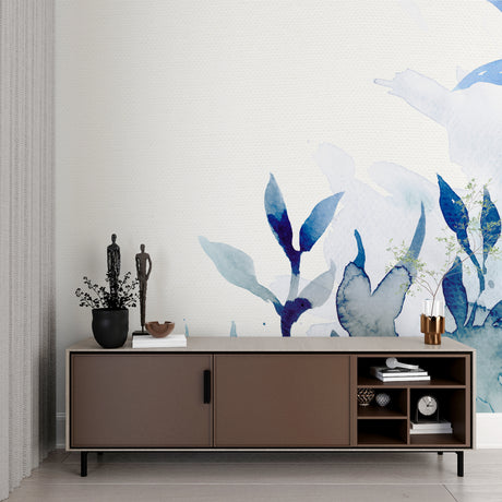 Blue watercolor floral wallpaper in a bright modern living room creating a peaceful atmosphere