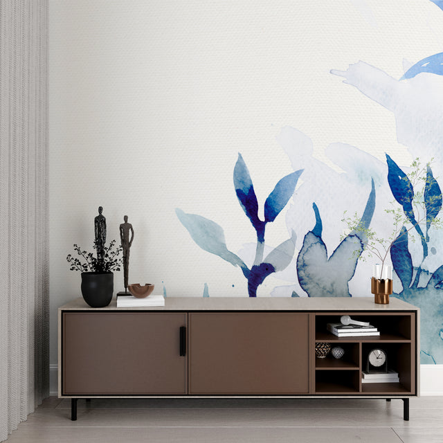 Blue watercolor floral wallpaper in a bright modern living room creating a peaceful atmosphere