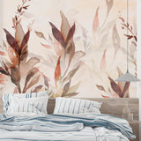 Bedroom wall with watercolor autumn leaves mural in soft, calming terracotta shades