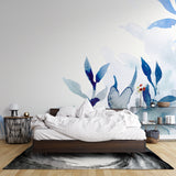 Blue watercolor botanical wallpaper in home office setting with minimal furniture
