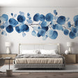 Blue Eucalyptus Watercolor Wallpaper creates a serene atmosphere in a modern bedroom with white furniture