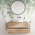 Eucalyptus watercolor wallpaper creating a serene atmosphere in a modern bathroom with white fixtures and natural wood accents