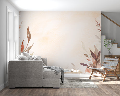 Watercolor leaf wallpaper in modern living room showing terracotta tones against white furniture