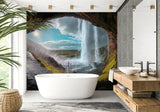 Waterfall cave mural bringing drama to a modern living room with floor-to-ceiling nature vista effect