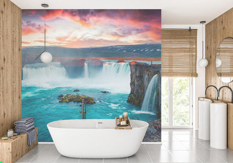 Waterfall wallpaper mural creating a stunning backdrop in a modern living room with natural light and minimal furniture