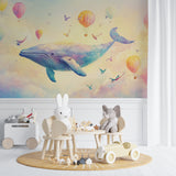 Playroom featuring whimsical whale wallpaper with floating hot air balloons and gentle colors