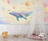 Reading nook with marine theme wallpaper showing dreamy whales and colorful hot air balloons