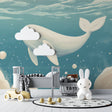 Whale wallpaper mural creating a magical atmosphere in a modern nursery with soft lighting