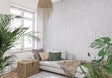 White brick wallpaper in modern minimalist living room with gray sofa and metal accents
