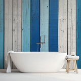 Coastal wood wallpaper with blue and white stripes creating a beach house feel in a modern living room