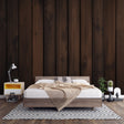 Dark brown wood plank wallpaper in modern dining room with natural light highlighting the vertical grain pattern