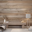 Pine plank wallpaper creating a warm atmosphere in a modern living room with grey sofa and plants