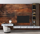 Rustic wood wallpaper creating a warm atmosphere in modern living room with grey sofa and natural decor