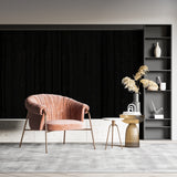 Modern black wood pattern wallpaper in contemporary living room with tall windows and minimal furniture