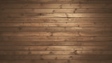 Rustic brown wood wallpaper adding warmth to a minimalist bedroom setting