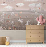 Pink woodland mural featuring cute animals in a cozy playroom setting