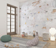 World Map Wallpaper in bright kids bedroom, showing animals and airplanes creating an educational play space