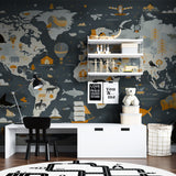Kids gathering around world map wallpaper in a reading nook learning about animals