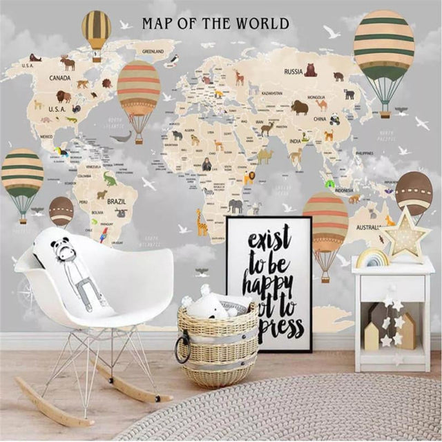World map wallpaper in bright kids bedroom showing continents and animals, creating an educational play space